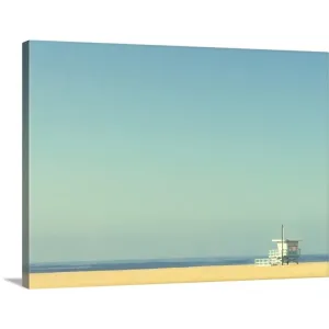 "Life guard tower on beach with blue ocean and blue sky." Canvas Wall Art