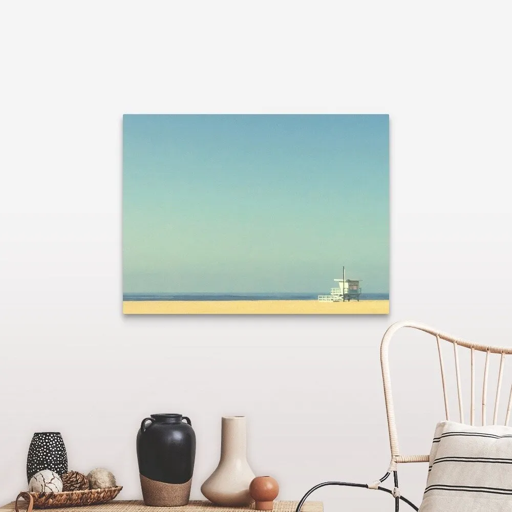 "Life guard tower on beach with blue ocean and blue sky." Canvas Wall Art
