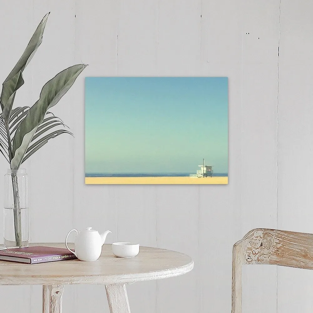"Life guard tower on beach with blue ocean and blue sky." Canvas Wall Art